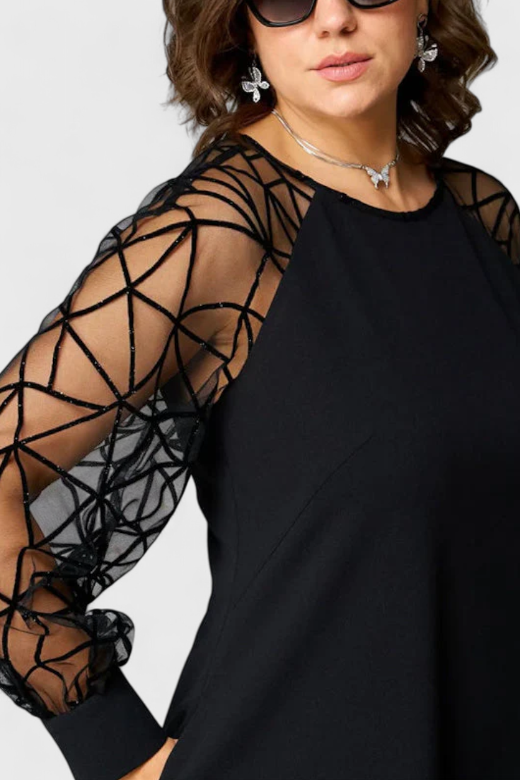 Vestido Negro Bellezza con Mangas de Malla y Corte Suelto